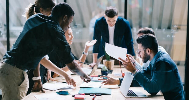 Corporate Strategy & Team Coaching Business leaders in a meeting planning organizational strategy and staff training under advisory from NKABC Confidante.